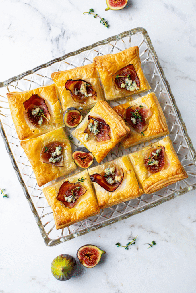 20 Christmas Party Appetizers That Will Steal the Show 13 Fig and Prosciutto Puff Pastry Bites