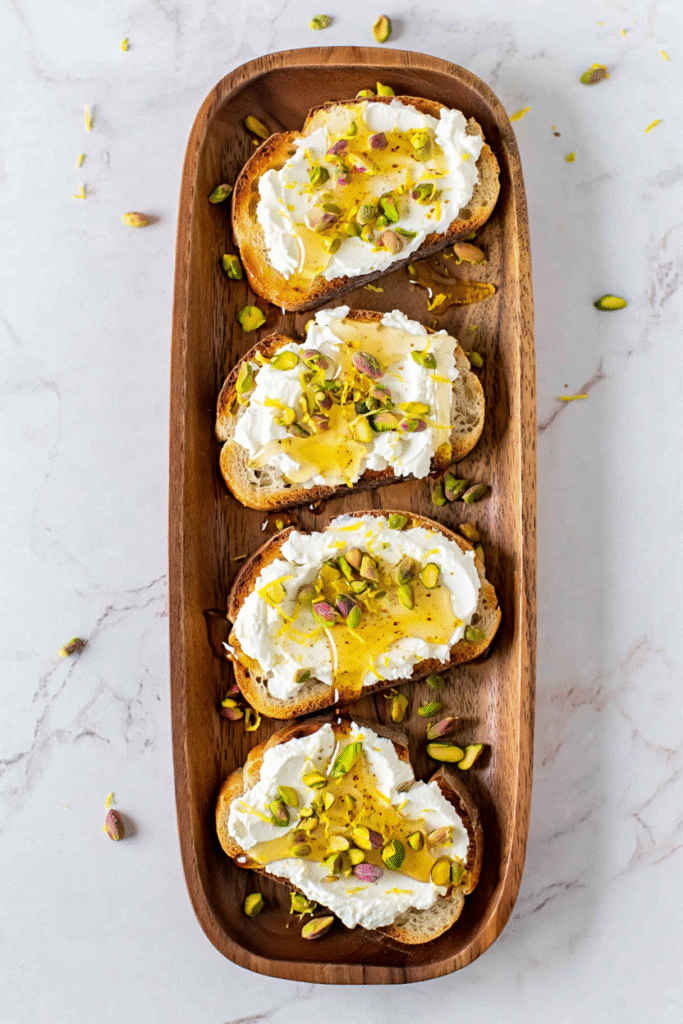 20 Christmas Appetizer Ideas to Elevate Your Holiday Spread 15 Whipped Ricotta Toast with Honey and Pistachios